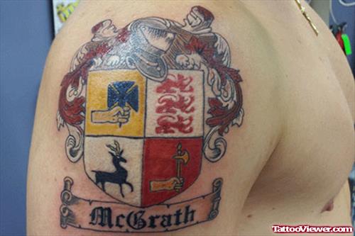 Colored Family Crest Tattoo On Man Right SHoulder