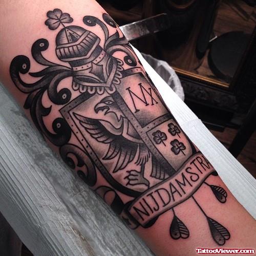 Awesome Grey Ink Family Crest Tattoo On Arm
