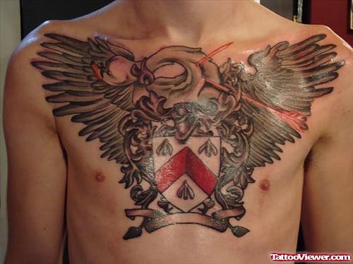 Winged Family Crest Tattoo On Man Chest