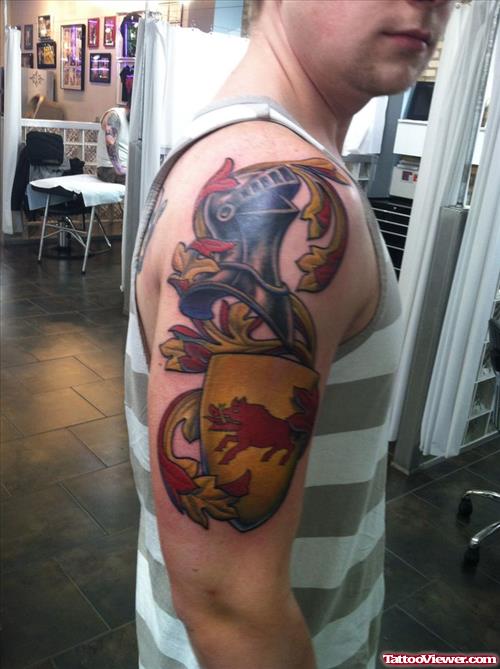 Man With Colored Family Crest Tattoo