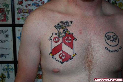 Red Ink Family Crest Tattoo On Chest