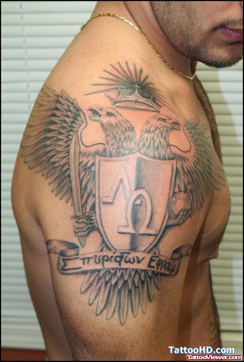 Grey Ink Family Crest Tattoo On Man Right Shoulder