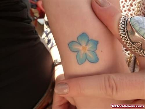 Blue Flower Tattoo On Arm