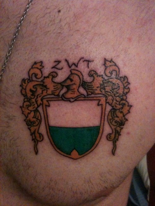 Color Family Crest Tattoo On Man Chest