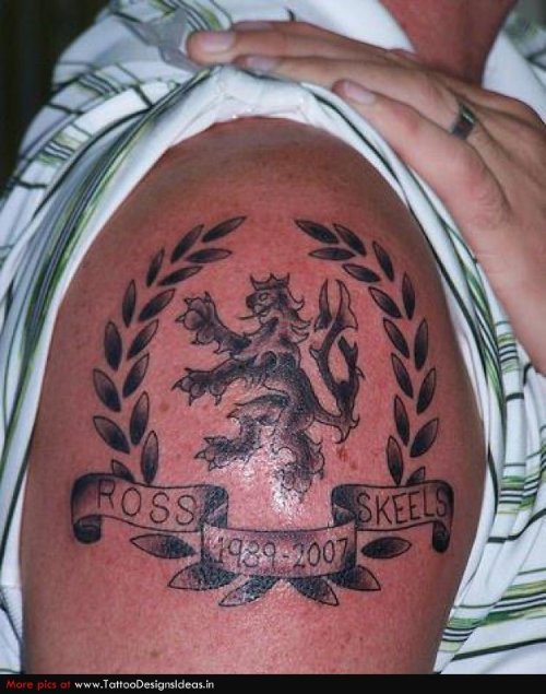 Cute Grey Ink Family Crest Tattoo On Right Shoulder