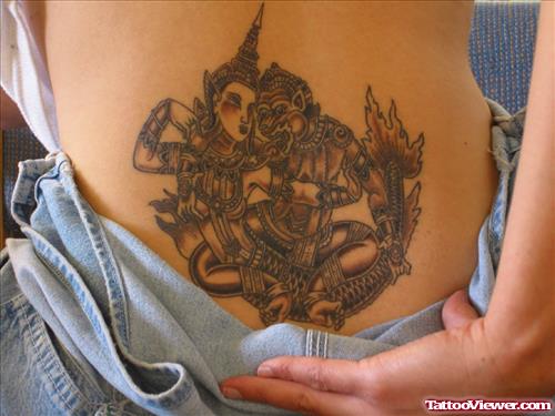 Grey Ink Lowerback Fantasy Tattoo For Girls