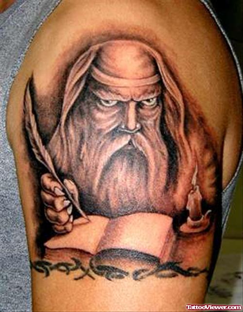 Grey Ink Fantasy Tattoo On Left Shoulder