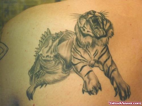 Grey Ink Fish And Tiger Fantasy Tattoo On Back