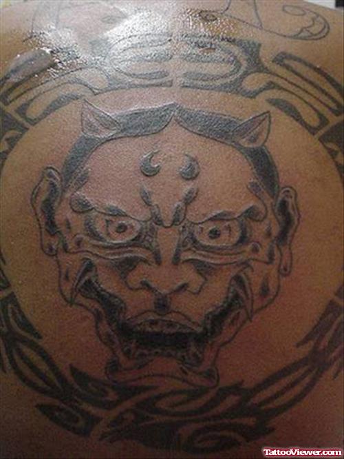Tribal And Demon Head Fantasy Tattoo