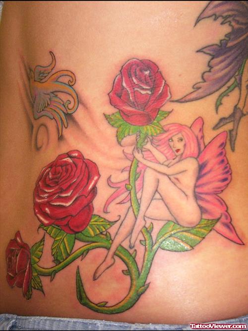 Red Rose Flowers And Fantasy Tattoo On Lowerback