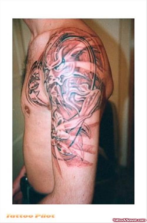 Grey Ink Fantasy Tattoo On Man Left Shoulder
