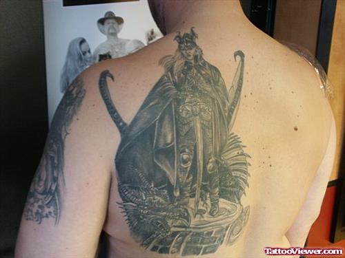 Grey Ink Fantasy Tattoo On Left Back Shoulder
