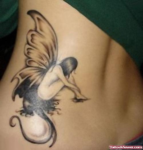 Grey Ink Fairy Fantasy Tattoo On Lowerback