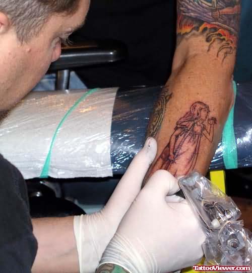 Fantasy girl Tattoo Making On Arm