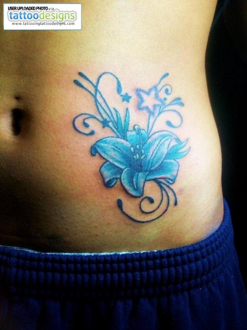 Blue Ink Flower Fantasy Tattoo On Side Rib