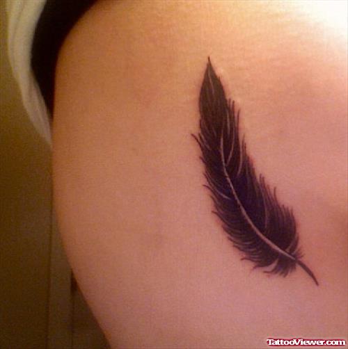 Rib Black Ink Feather Tattoo