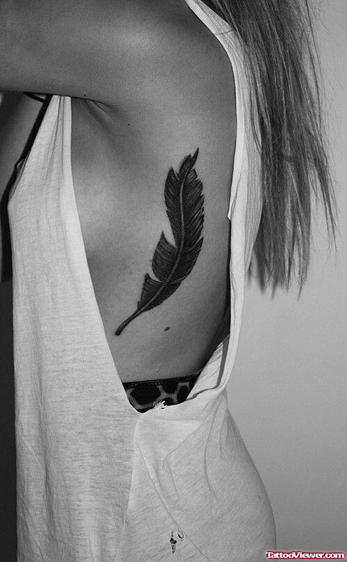 Wonderful Girl Rib Feather Tattoo