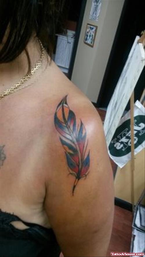 Colored Feather Tattoo On Girl Left SHoulder