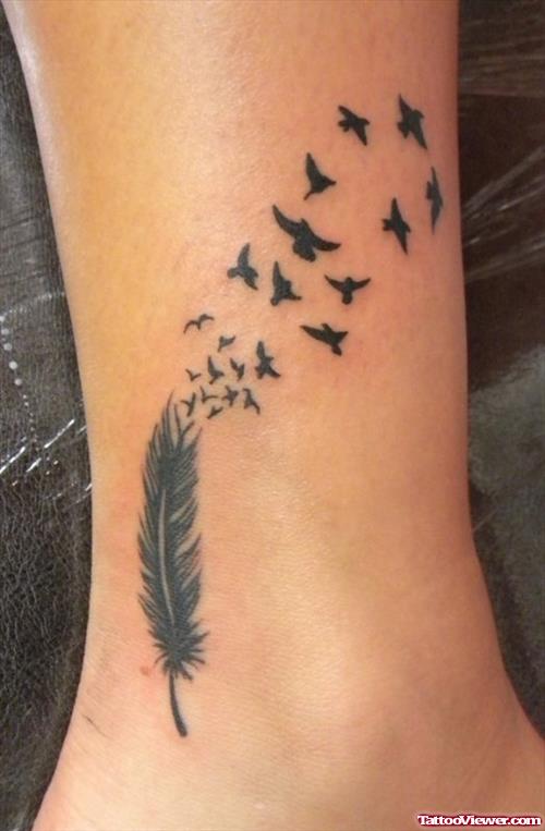 Black Ink Flying Birds And Feather Tattoo On Ankle