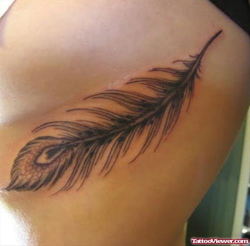 Grey Feather Tattoo On Rib