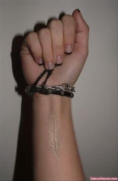 Feather Tattoo On Girl Wrist