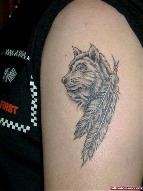 Wolf Head And Feather Tattoo On Left Shoulder