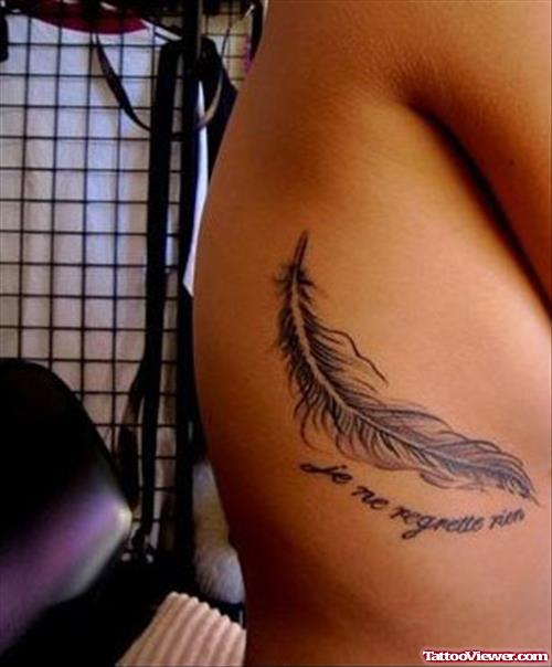 Single Grey Ink Feather Tattoo