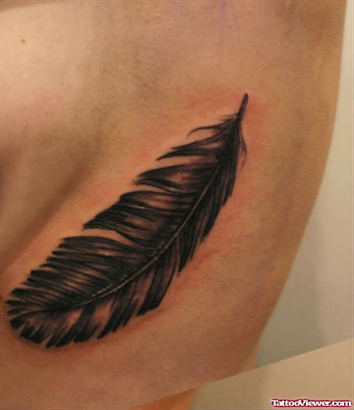 Rib Black Feather Tattoo