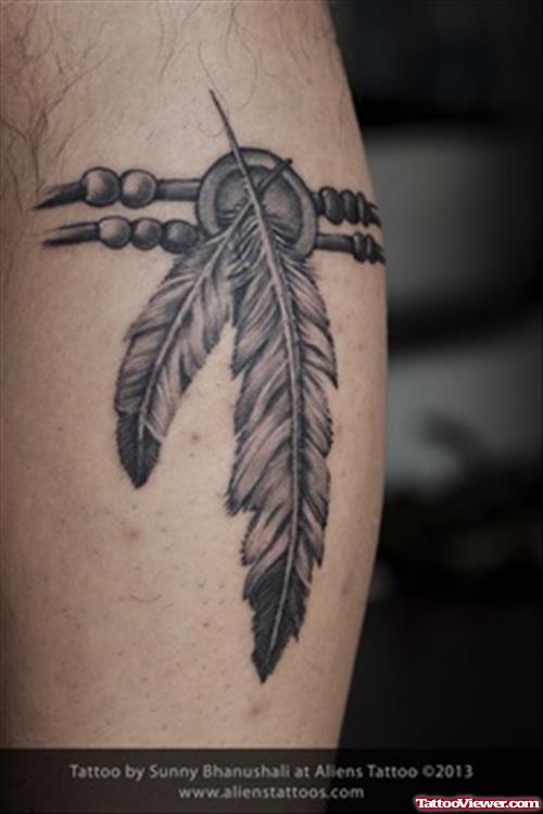 Grey Ink Feather Tattoo On Rib