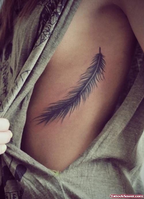 Showing Feather Tattoo On Side