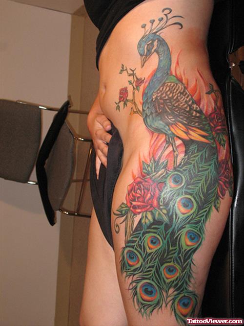 Peacock And Colored Feathers Tattoos On Side