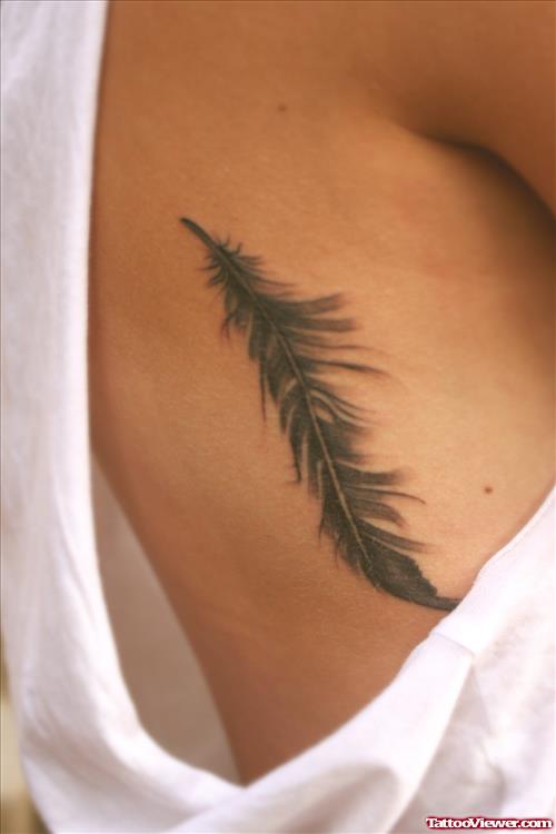 Impressive Rib side Feather Tattoo
