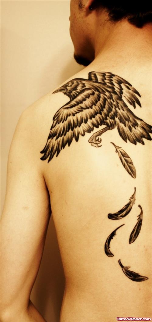 Flying Crow And Feathers Tattoos On Back