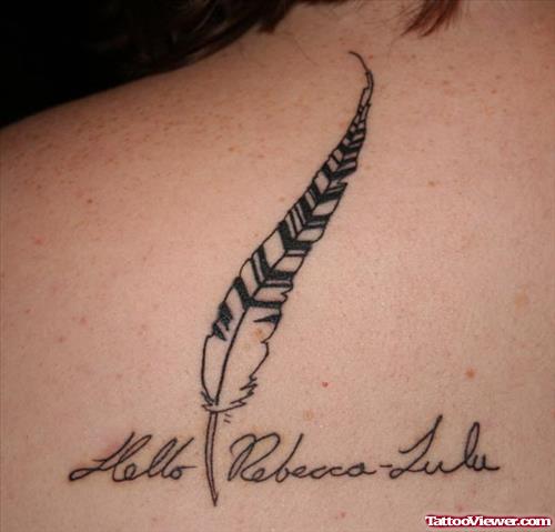 Lettering And Feather Tattoo On Back