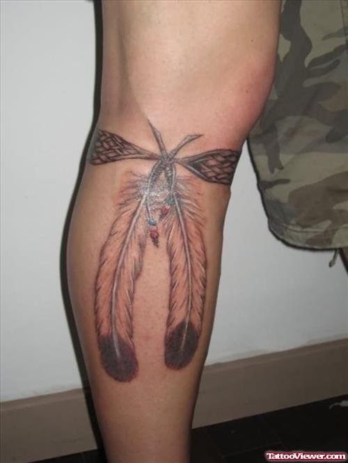 Left Leg Grey Ink Feather Tattoo
