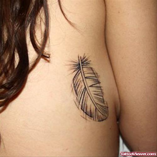 Grey Ink Rib Feather Tattoo For Girls