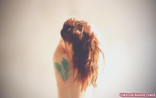 Girl With Peacock Feathers Tattoo On Back