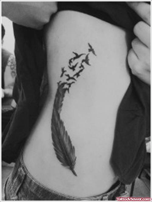 Girl Showing Feather Tattoo