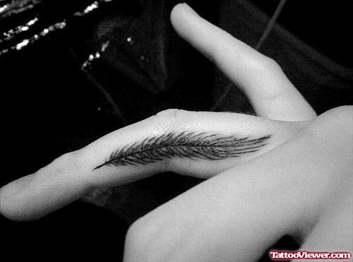 Attractive Feather Tattoo On Finger