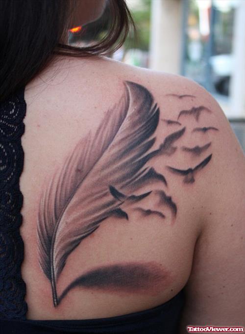 Large Grey Ink Feather Tattoo On Girl Back Shoulder