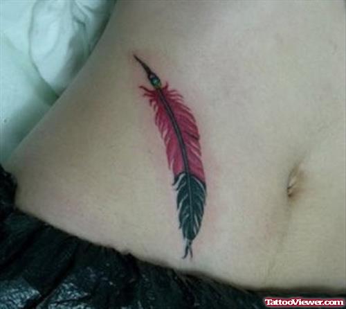 Attractive Colored Feather Tattoo On Hip
