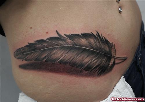 Grey Ink Feather Tattoo On Hip