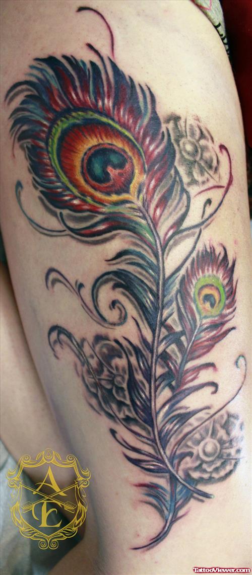 Awesome Colored Feather Tattoo On Half Sleeve