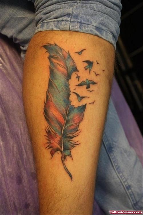Colored Ink Birds Flying From Feather Tattoo On Leg