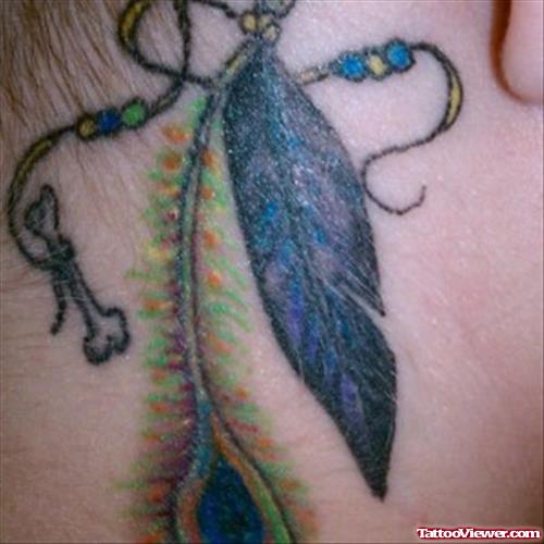 Awesome Colored Feather Tattoo