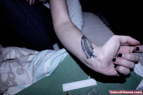 Girl Left Arm Feather Tattoo For Girls