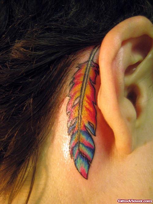 Colored Feather Tattoo Behind Ear