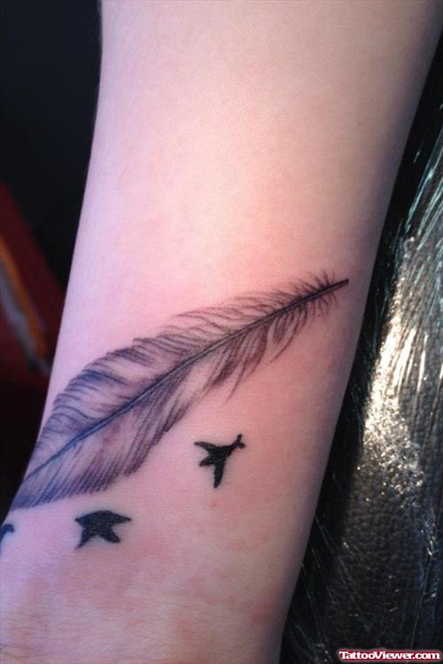 Black Birds And Feather Tattoo On Wrist