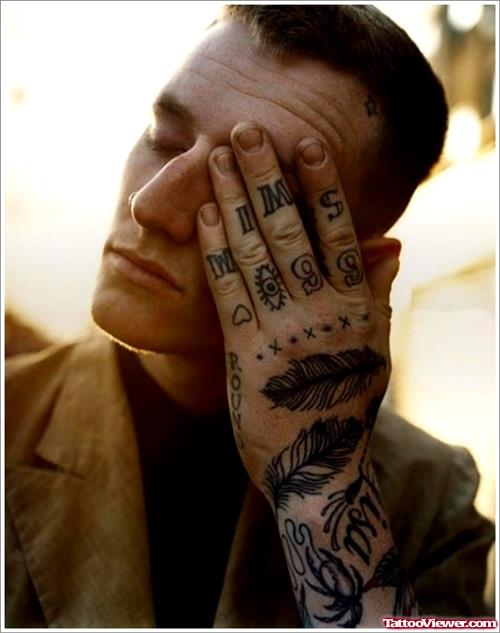 Crow Feather Tattoos On Left Hand
