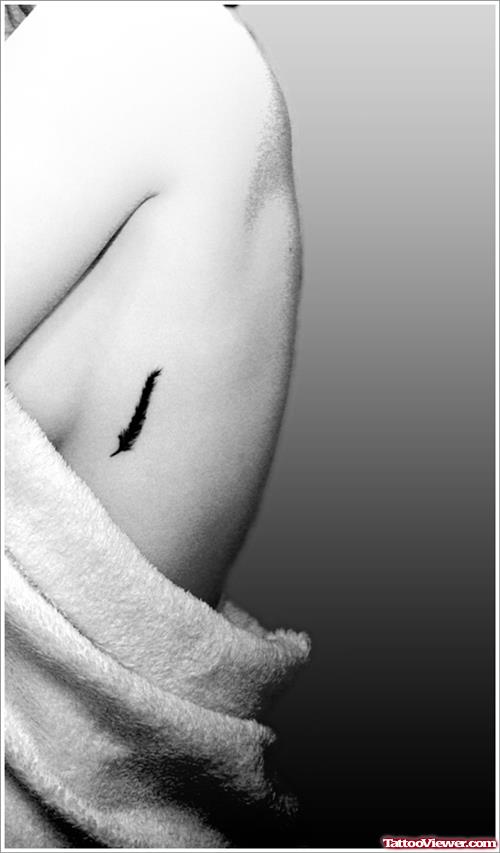 Black Feather Tattoo On Rib Side